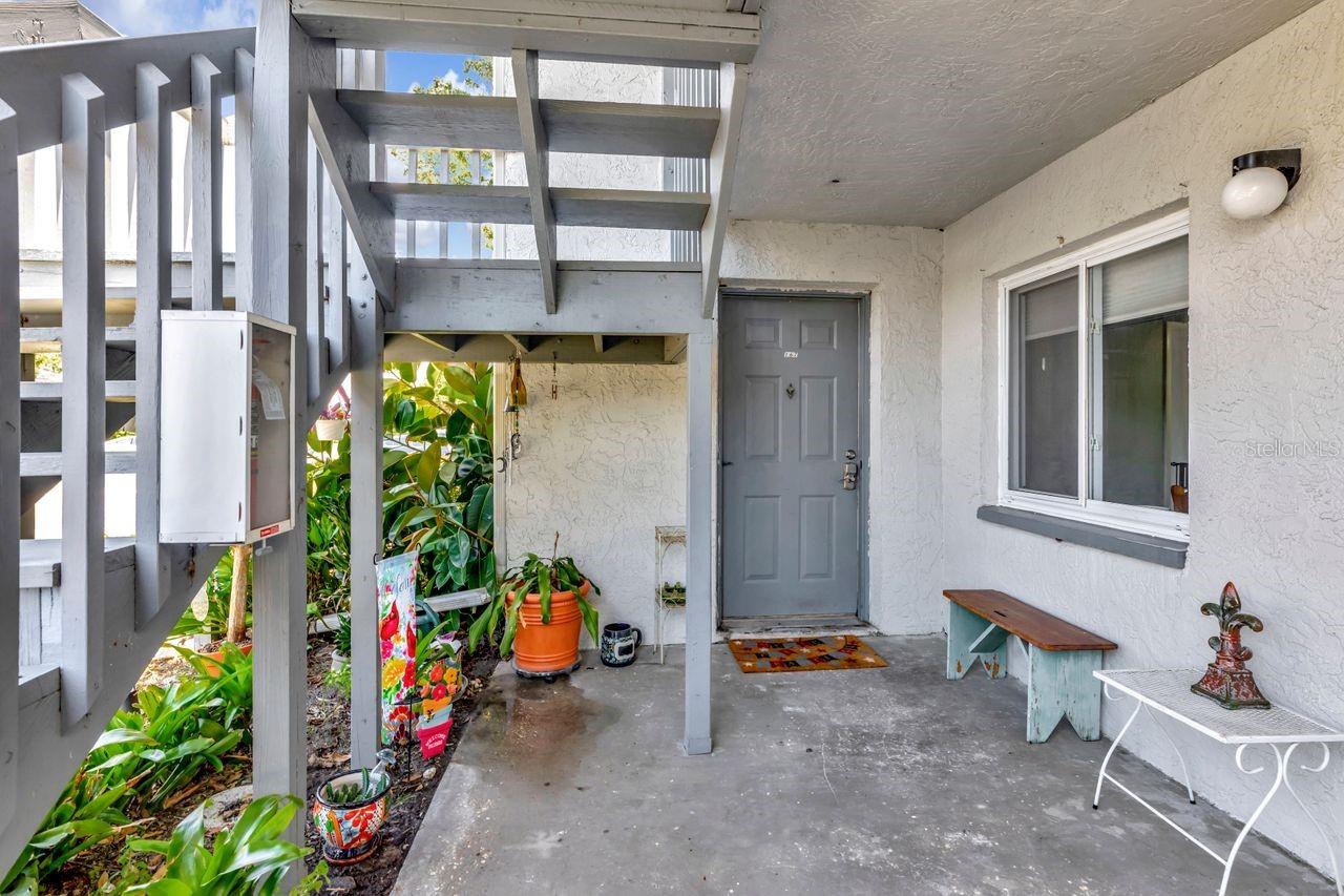 A spacious and cozy private front porch.