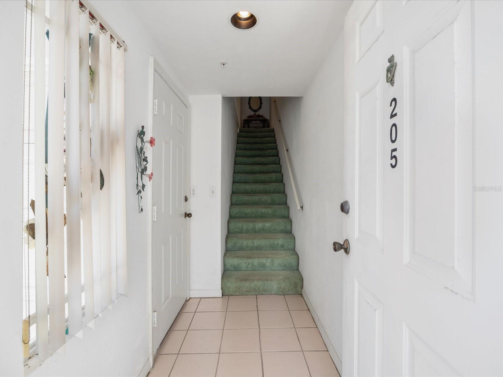 Front entryway with stairs leading up to the 2nd floor