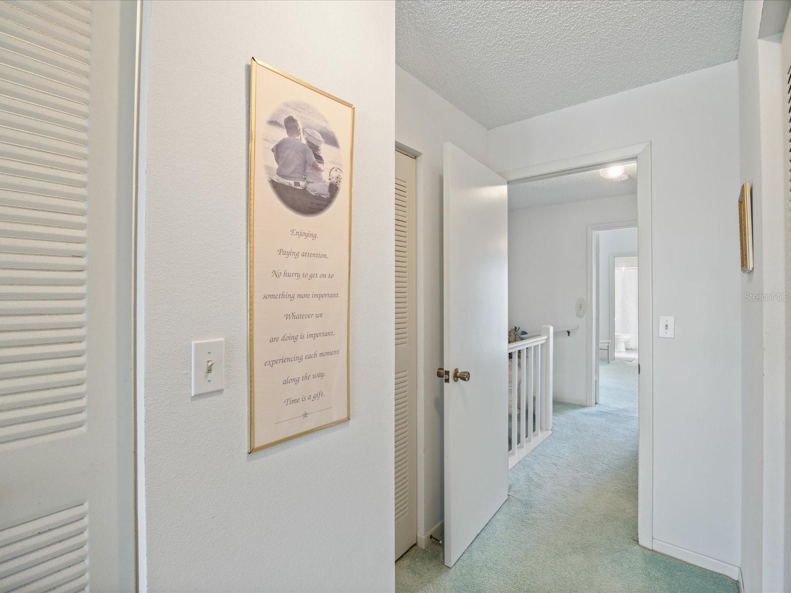 Primary bedroom facing out towards hallway