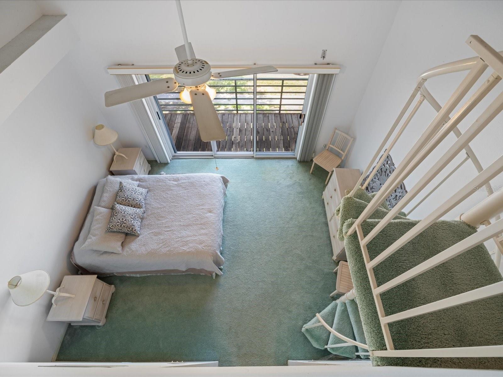 From loft looking down to primary bedroom