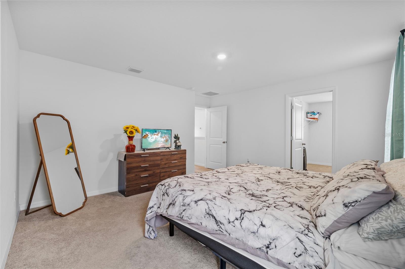Primary Bedroom with a King sized bed