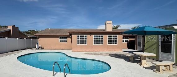 Back exterior with pool