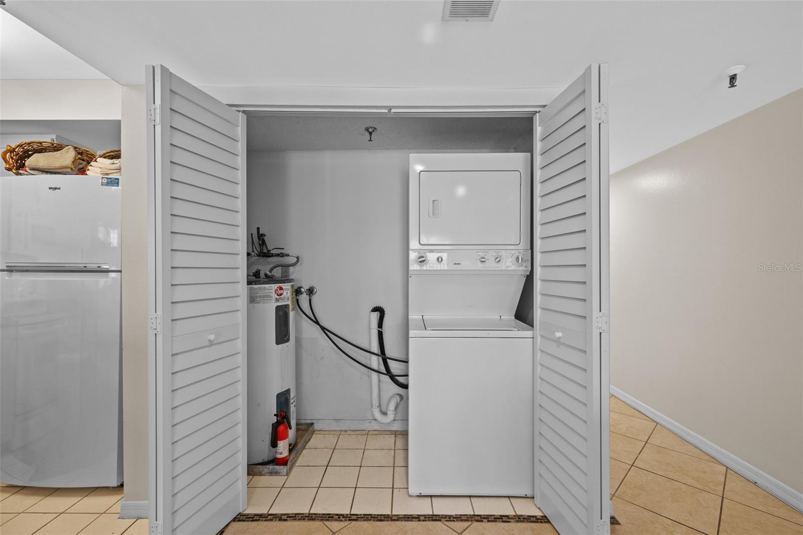 Laundry closet with extra storage room!