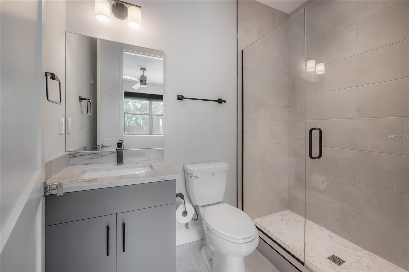 Full en suite bathroom on 1st level with shower
