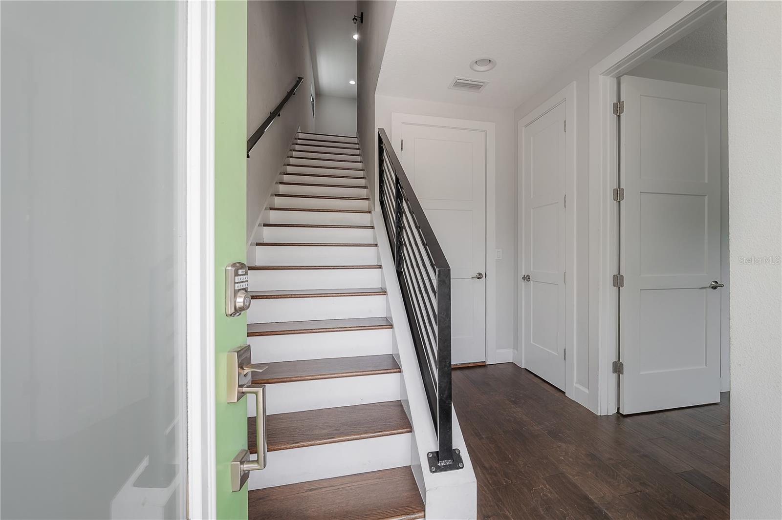 Entry with real wood stairs