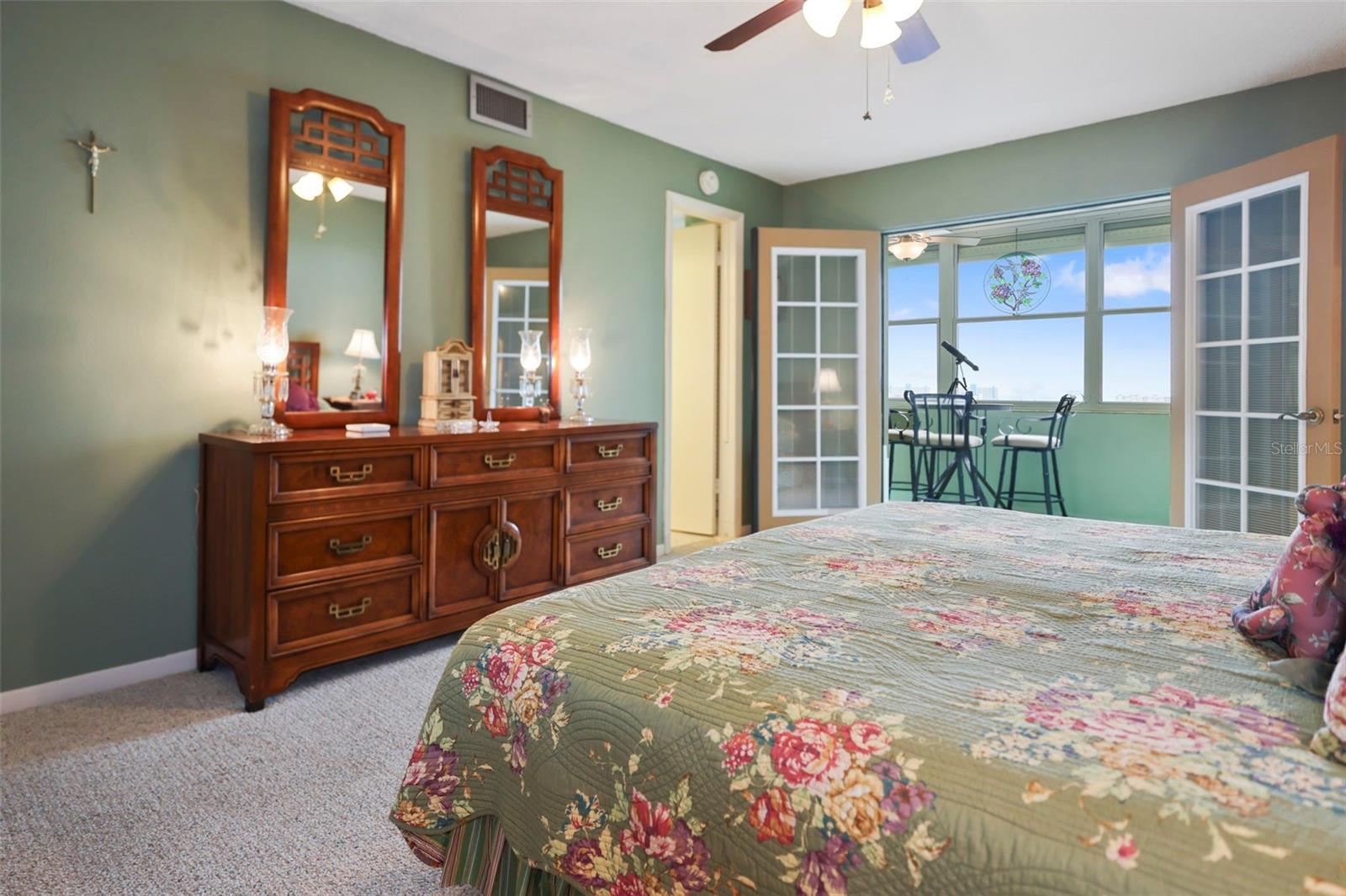 Primary Bedroom with FrenchDoors leading to Florida Room