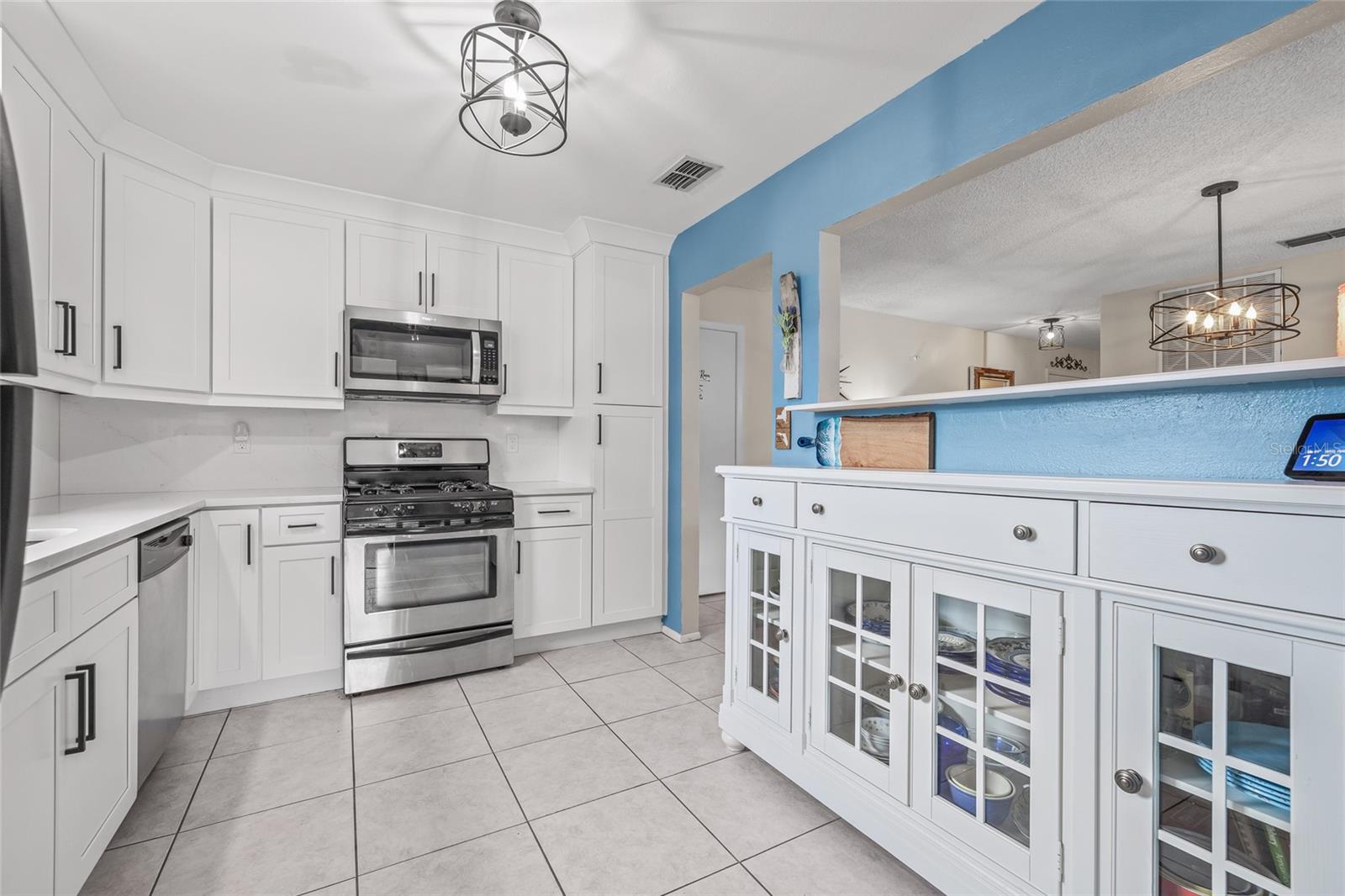 Updated kitchen with quartz counters.
