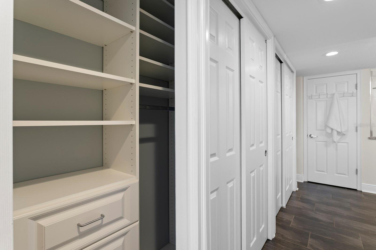 Custom closets cover an entriee wall. https://player.vimeo.com/video/1087835561