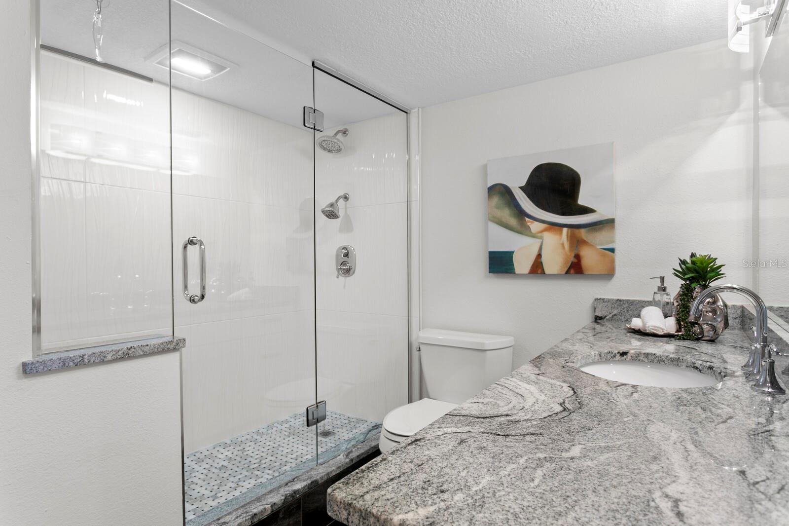 No-nonsense layout with a large walk-in shower and clean finishes. Simple, stylish, done.