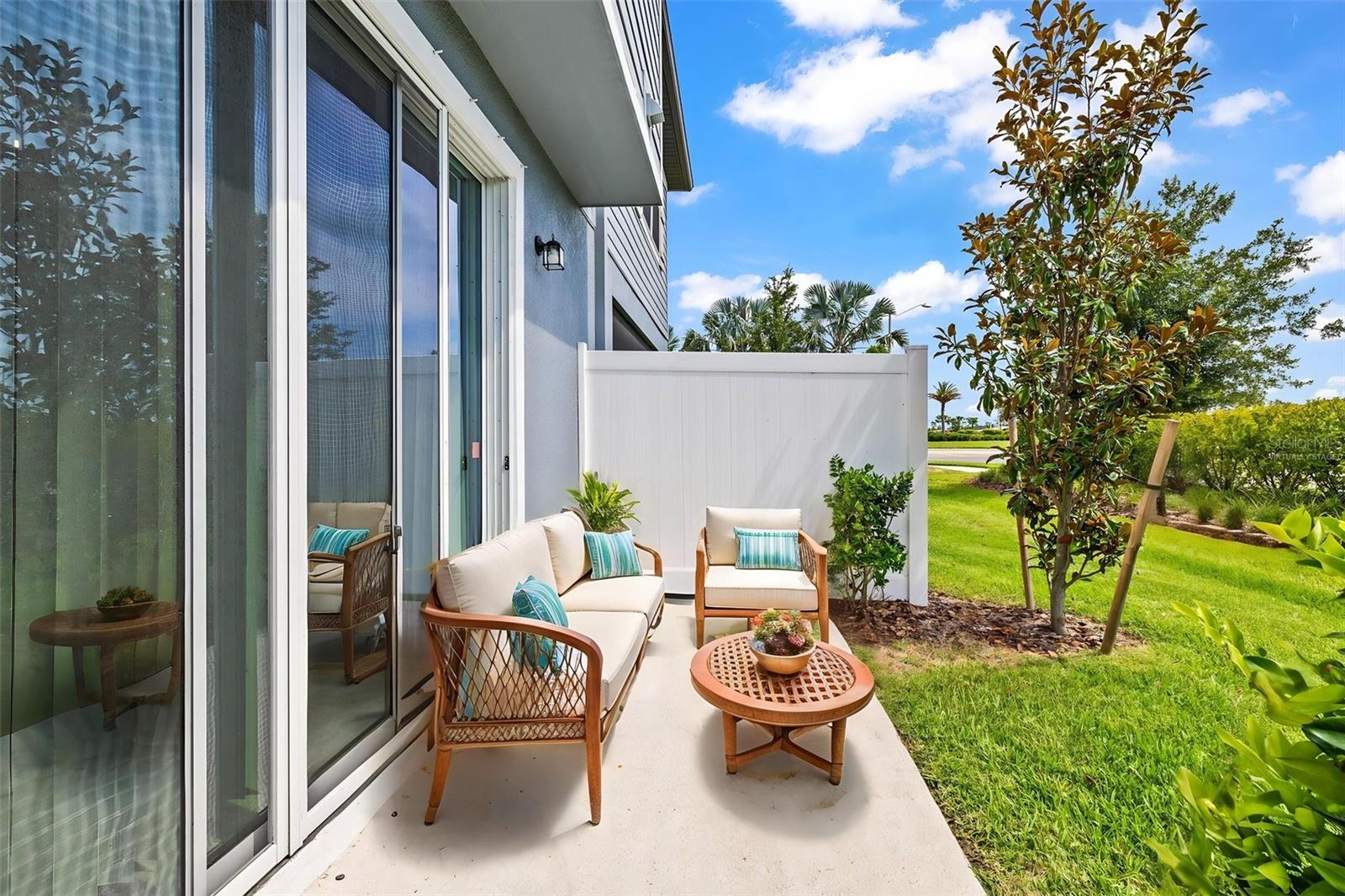 Virtually staged: Large outdoor space for grilling, lounging, and year round FL Living!