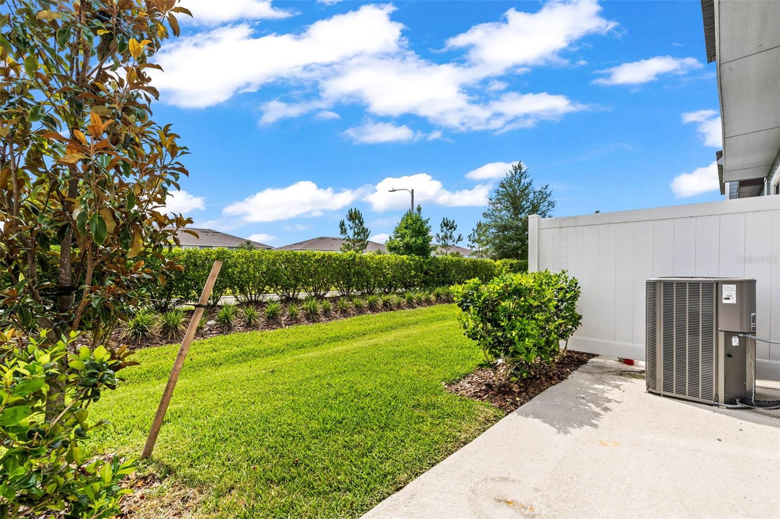 Landscaped for privacy from the road.