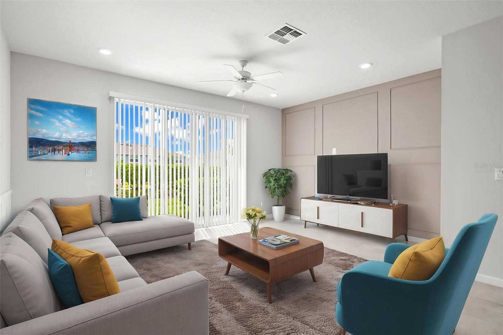 Virtually staged: Your living room has been accented with a moulding wall, sliding glass doors, and tile flooring.  Great space with tons of room for seating.