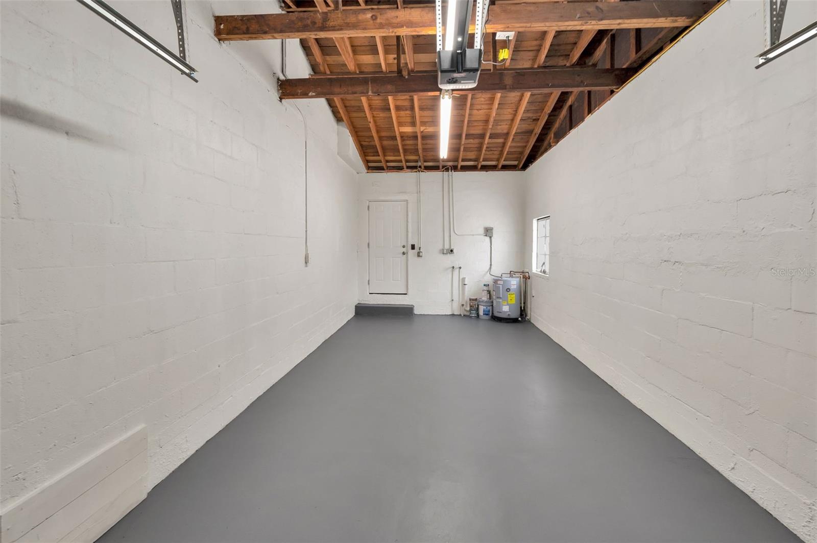 Attached one car garage with brand new garage door and electric opener