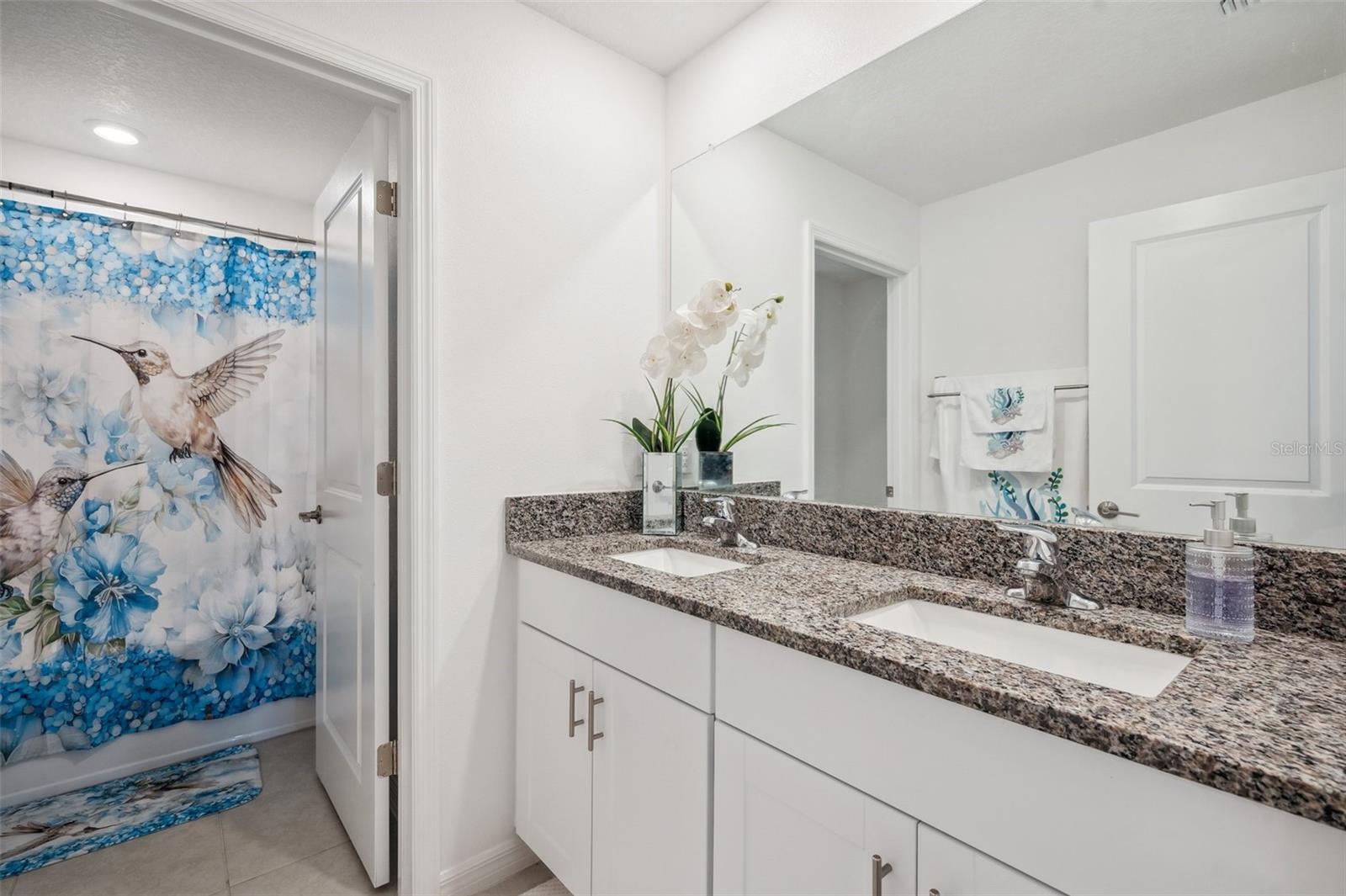 Second floor bathroom with dual sink vanity