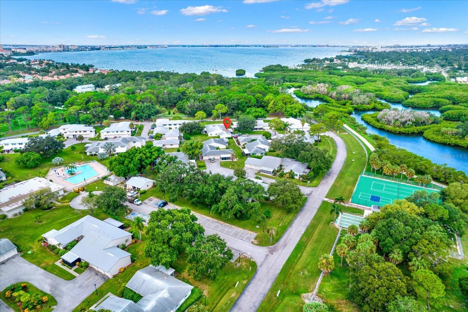 Steps from a private gated entrance to Clam Bayou—enjoy kayaking, nature trails, and peaceful boardwalks.