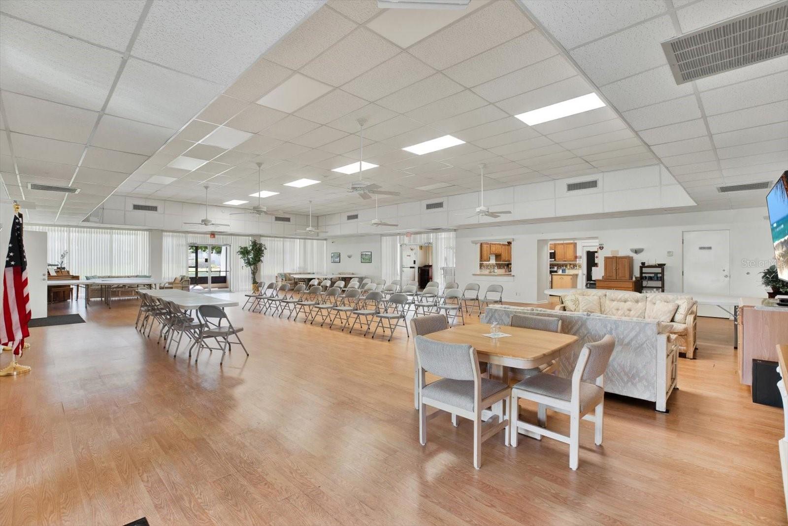 Community clubhouse with kitchen, library, pool table, and regular social events.