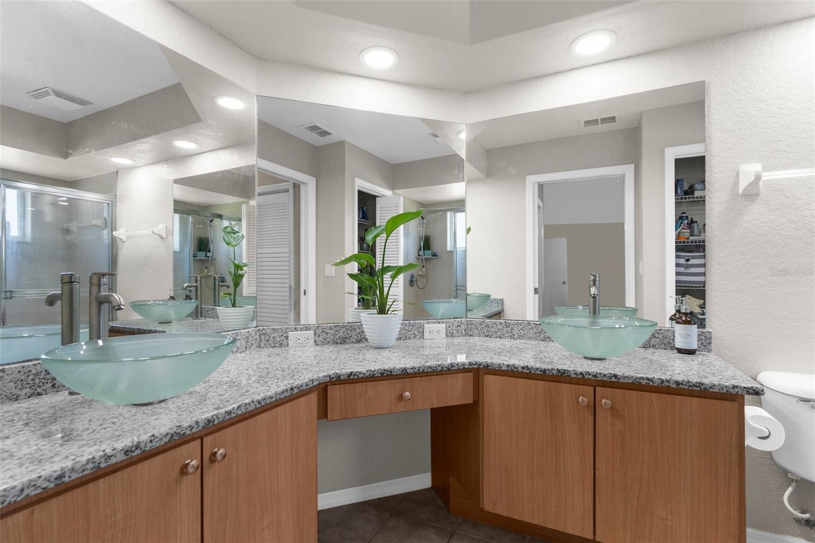 master bath, recessed LED lighting, granite counters, and vessel sinks