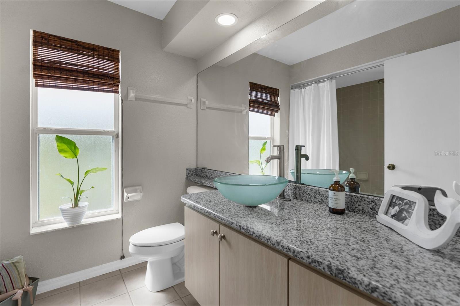 main bathroom, recessed led lighting, granite counters, & vessel sink