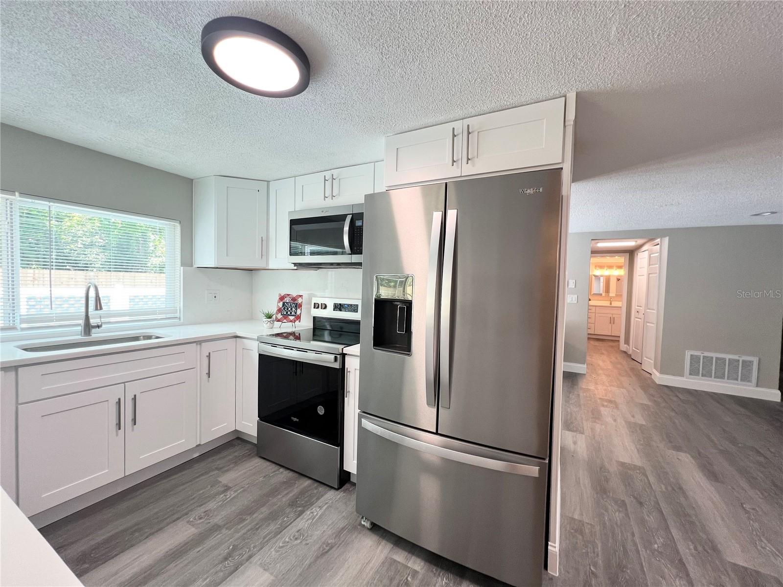 KITCHEN VIEW FROM FORMAL DINING AREA
