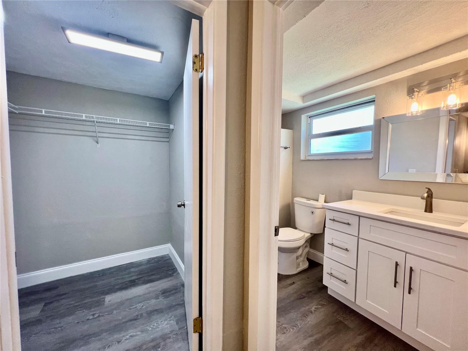 PRIMARY BATHROOM AND WALK IN CLOSET