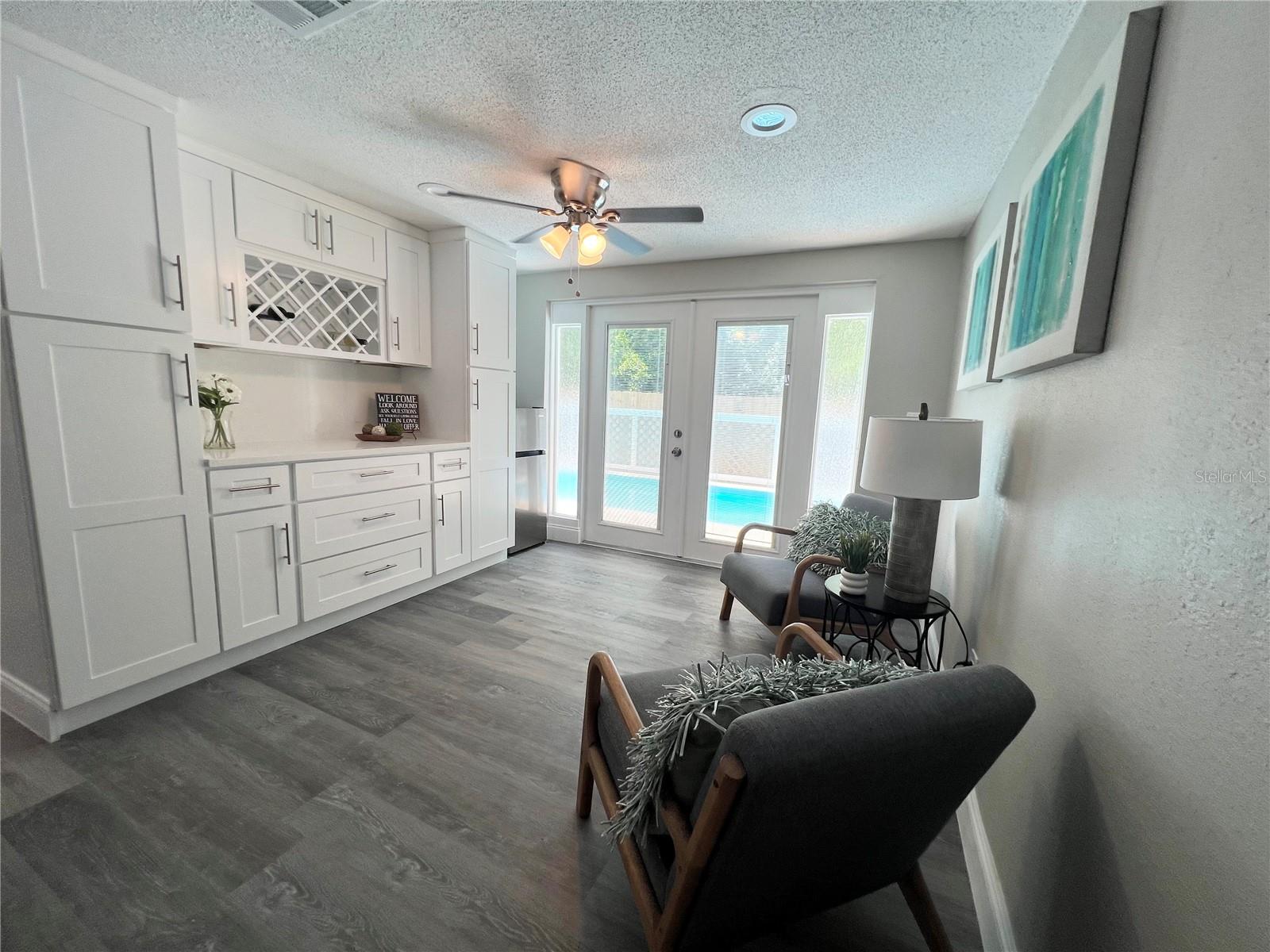 FAMILY ROOM, DRY BAR, FRENCH DOORS TO POOL AREA