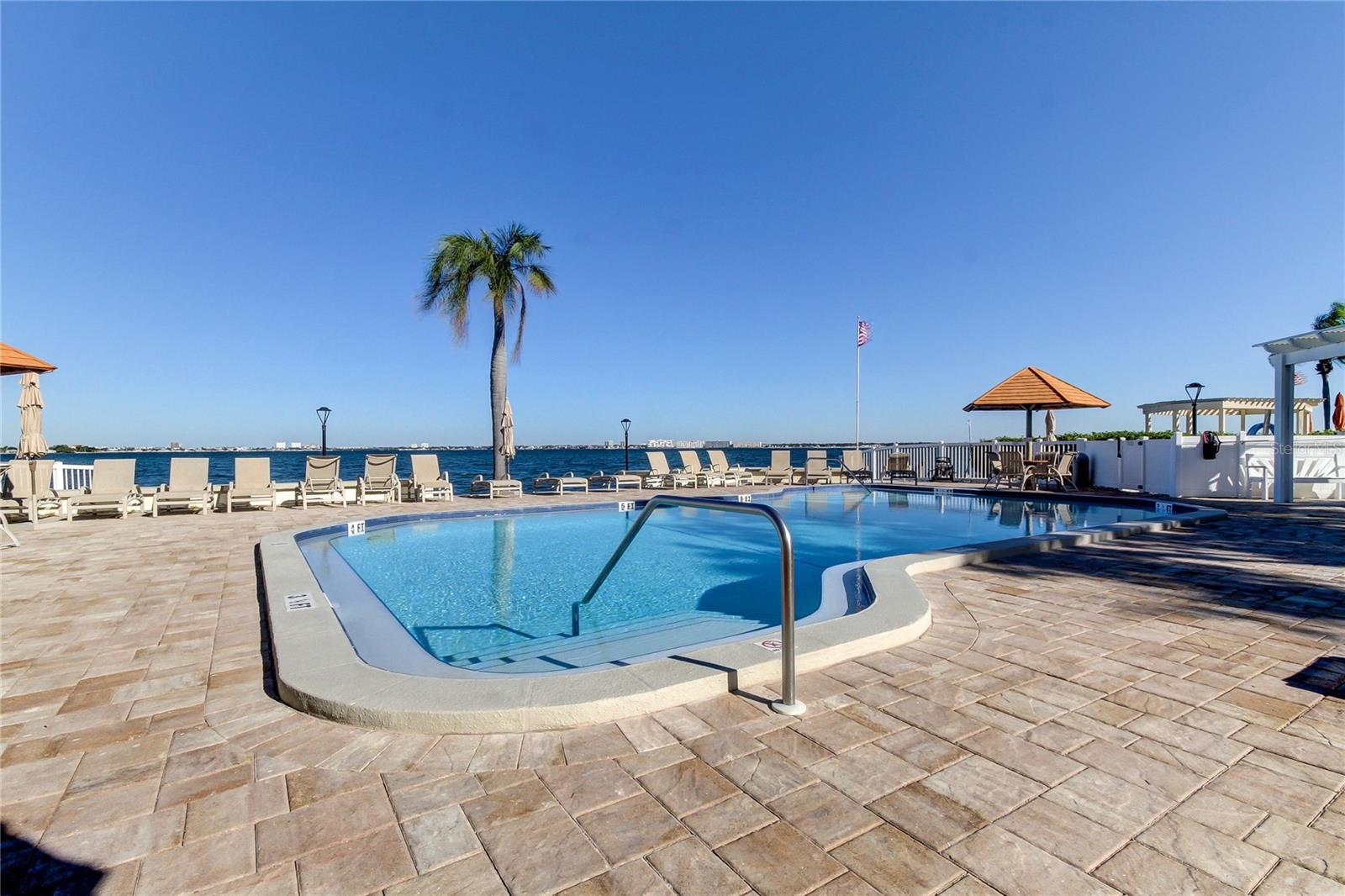 Heated pool and spa right on the Bay