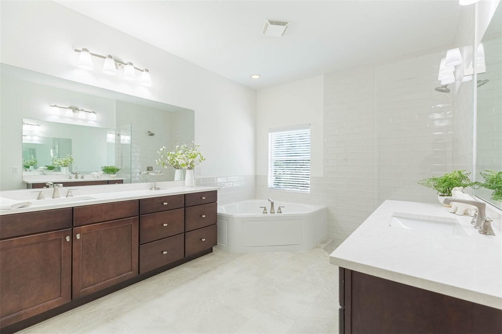 REMODELED primary bathroom with split vanities