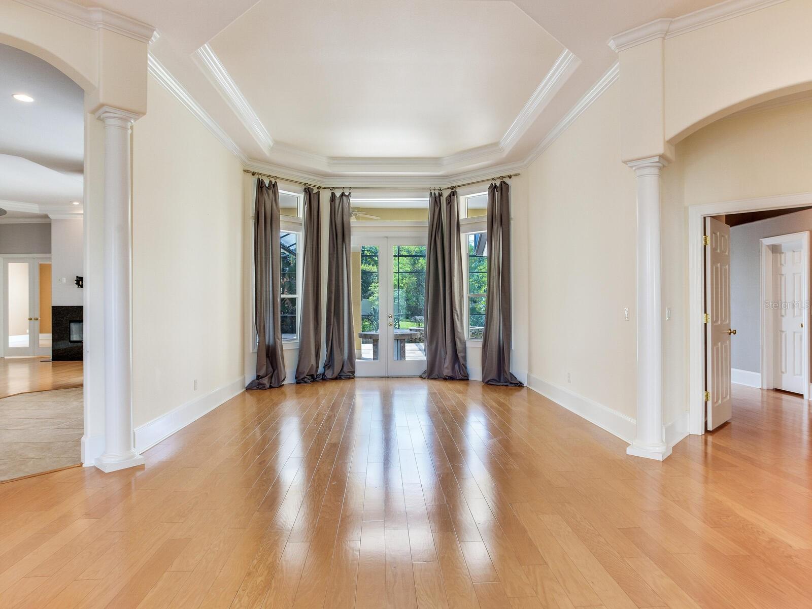 Formal Living (center) - Kitchen / Great Room (left) - Primary Suite (right)