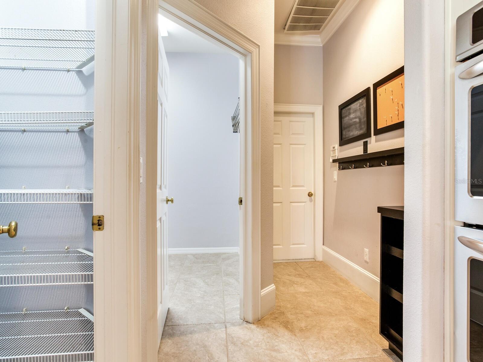 Pantry (left) - Laundry Room (center) - Garage Entrance (right)