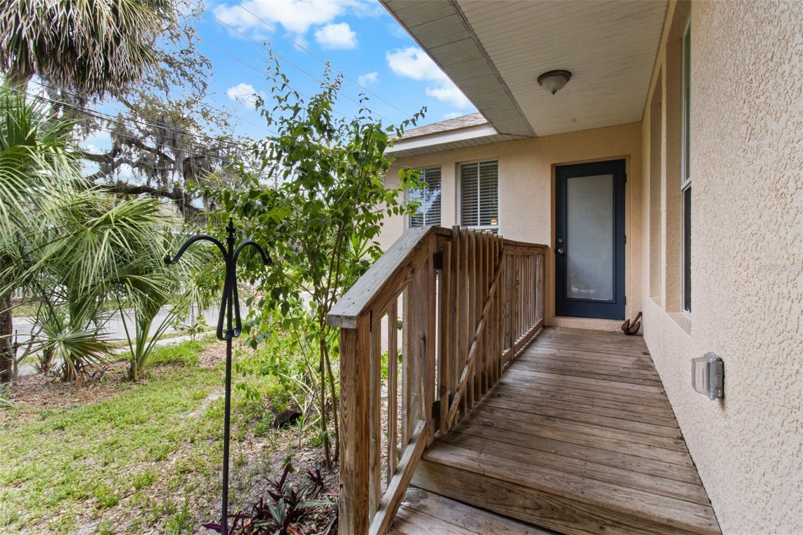 Rear entry from garage and driveway.