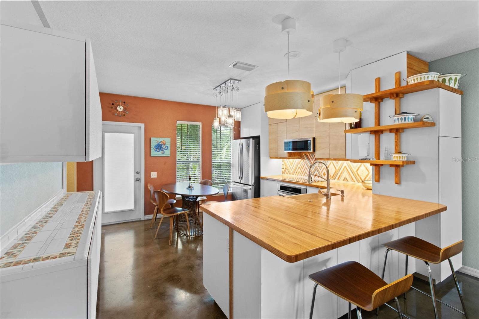 Beautiful updated kitchen with red oak butcher block countertops and custom made backsplash!