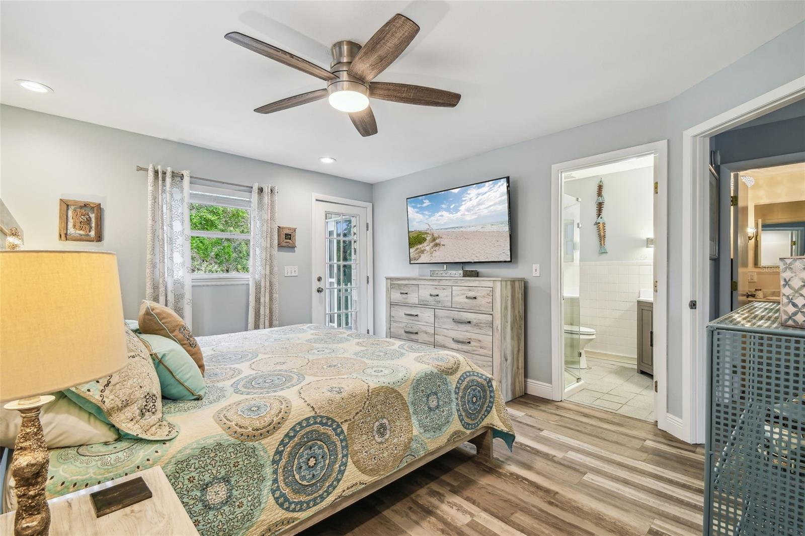 Primary Bedroom opens to private Balcony overlooking the water