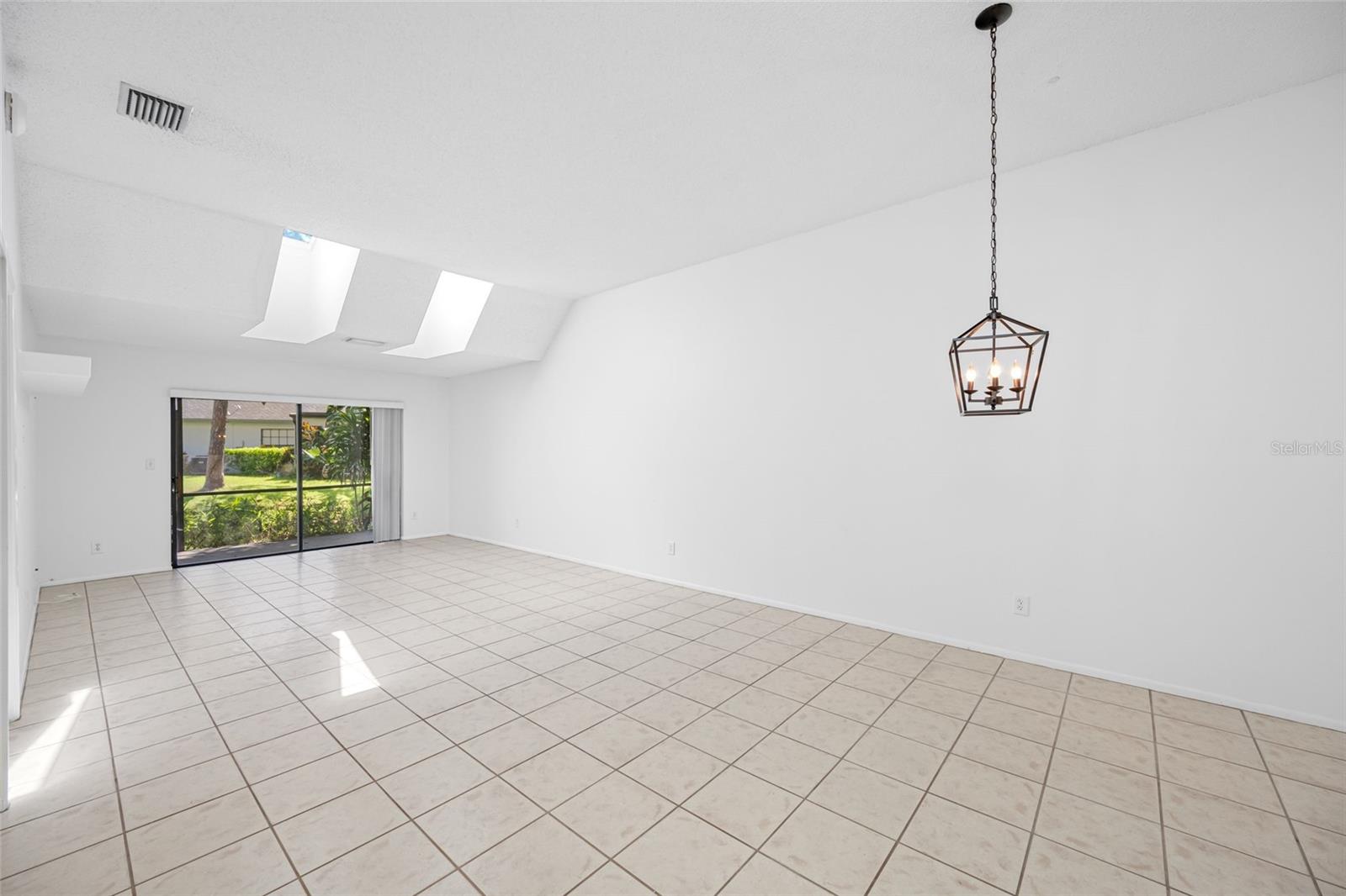 Dining & Living Room with Skylights