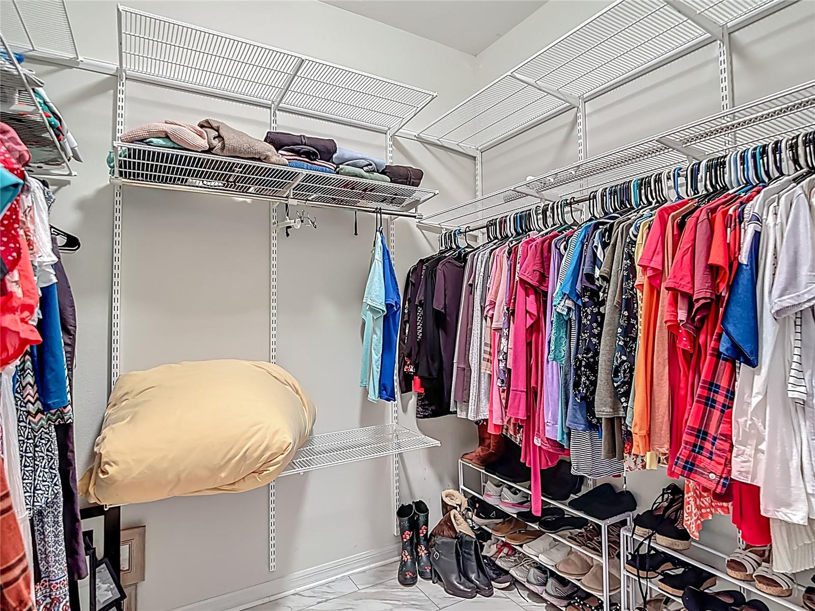 1 of 2 Walk In Closets in Primary Bedroom