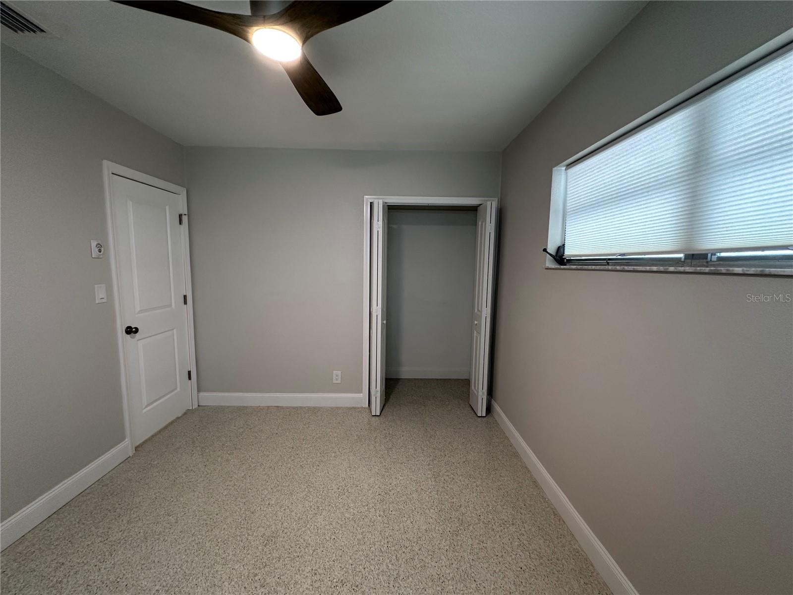 Bedroom 3 with closet door at the end