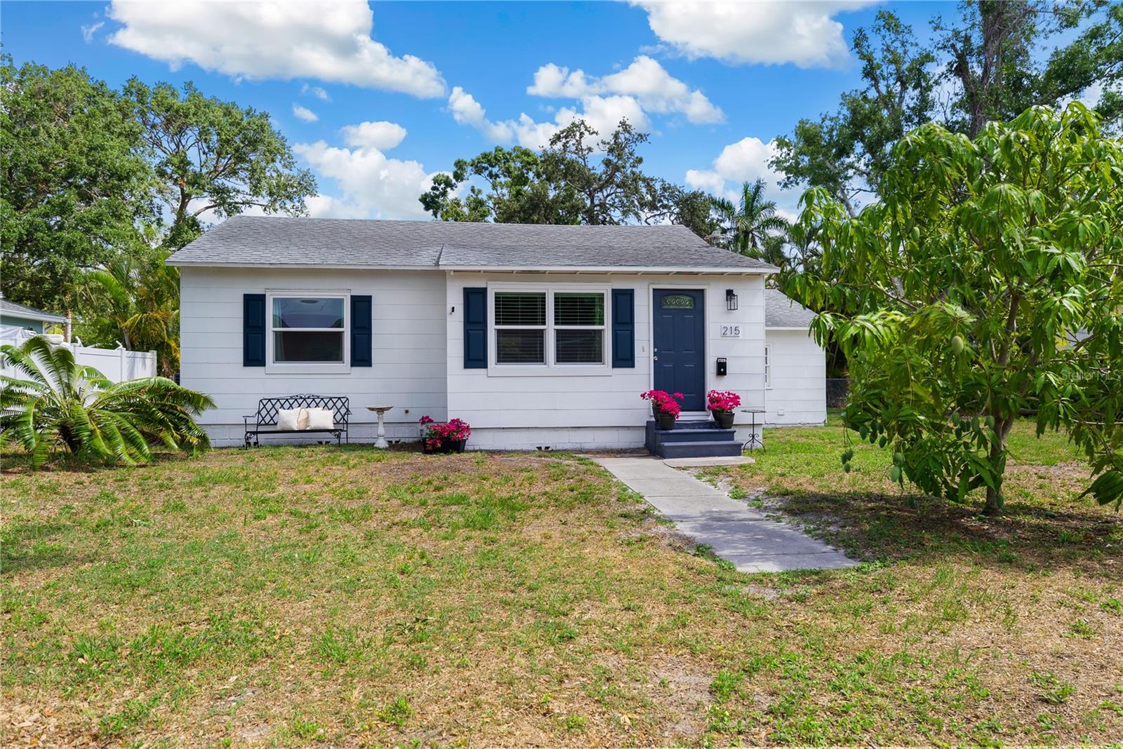 Adorable cottage on a 72 x 127 lot with plenty of space to grow, garden, add a pool and more!