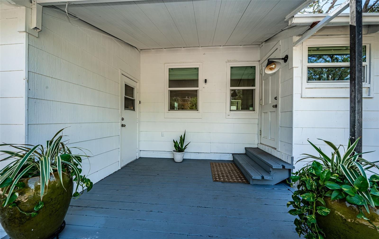 Facing the rear of the home, you enter the home on the right and the garage to the left. There is also garage access within the home.