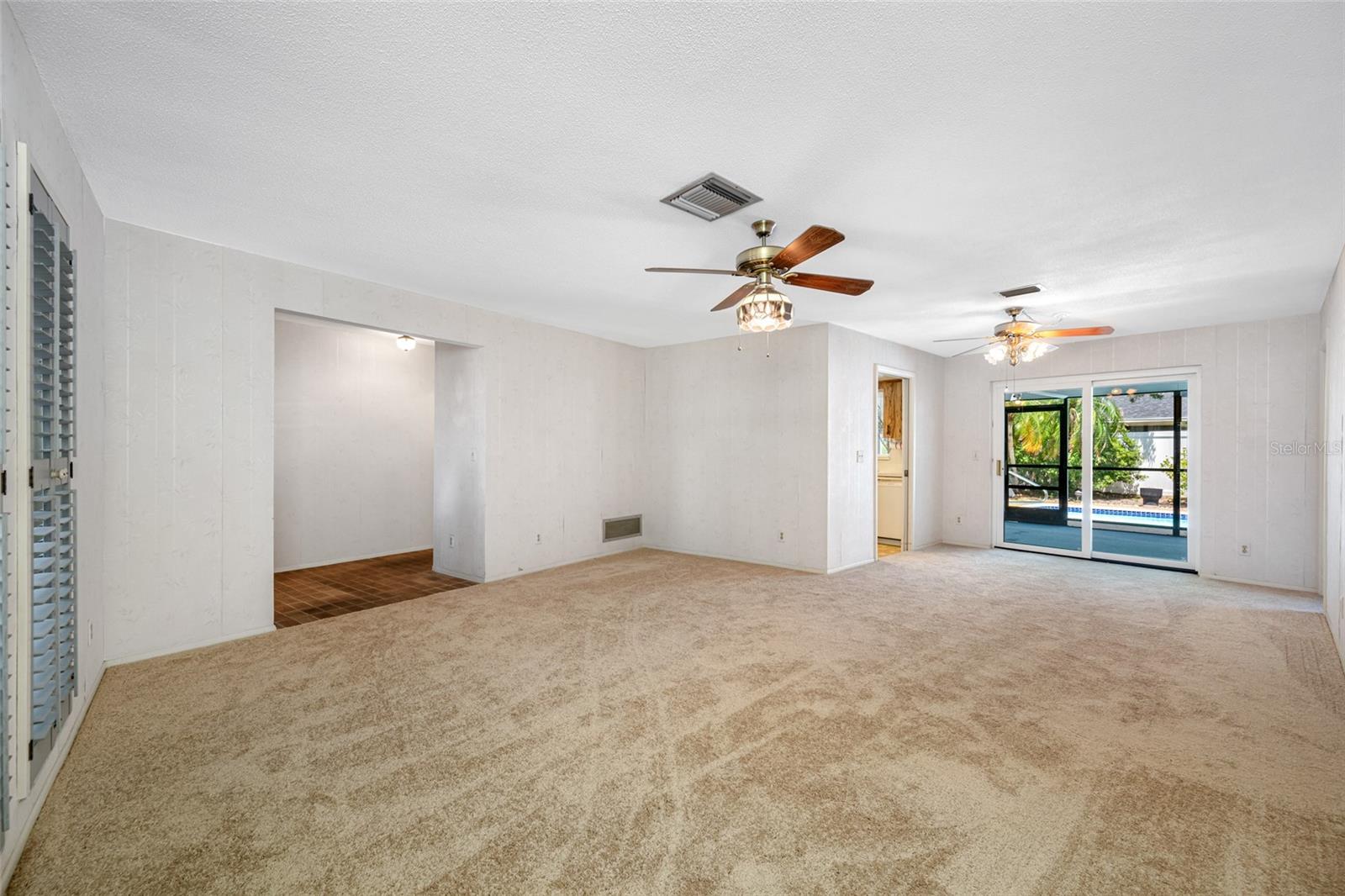 Living and Dining Room with Door to Pool