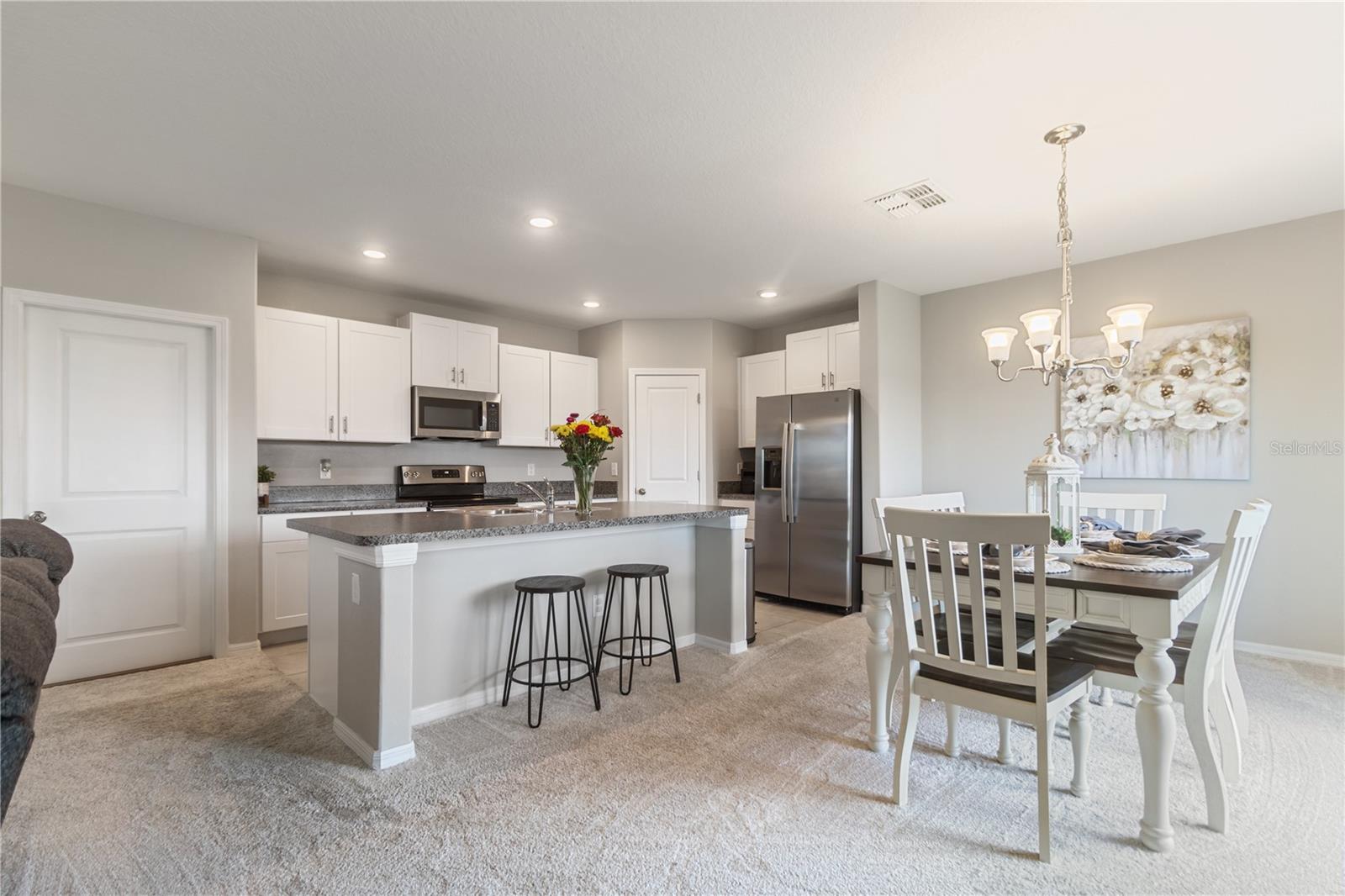 open kitchen, dining room, and living room combo