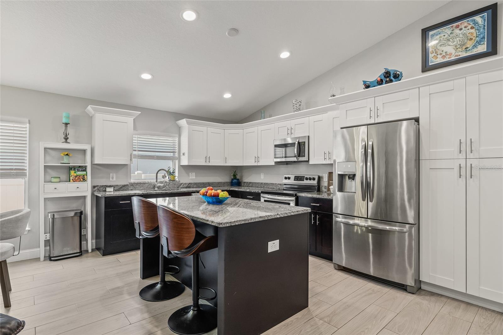 Whether you’re prepping a casual meal or entertaining guests, this kitchen offers generous counter space, soft-close drawers, and storage that keeps everything organized.