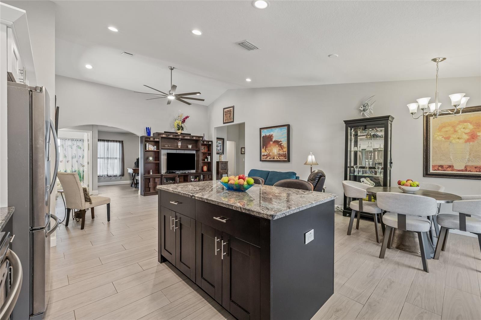 From the island, enjoy sightlines into the dining, living, and den areas—ideal for staying connected while you cook.