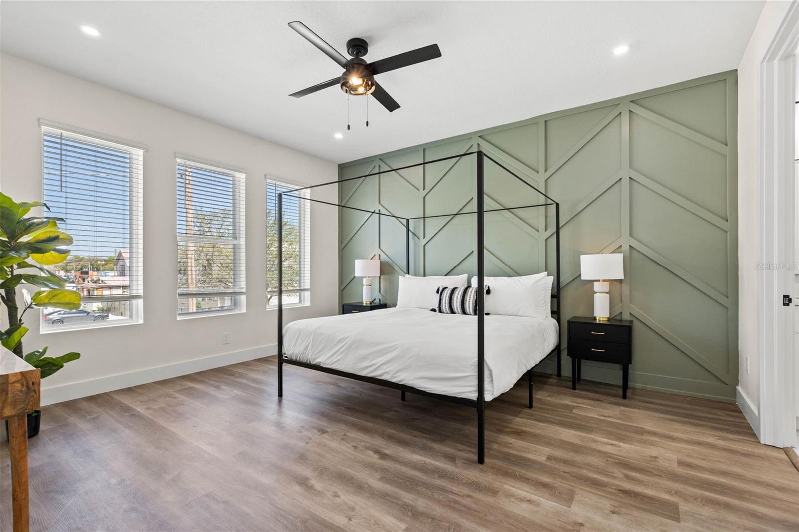 actual unit has a navy accent wall and an extra window