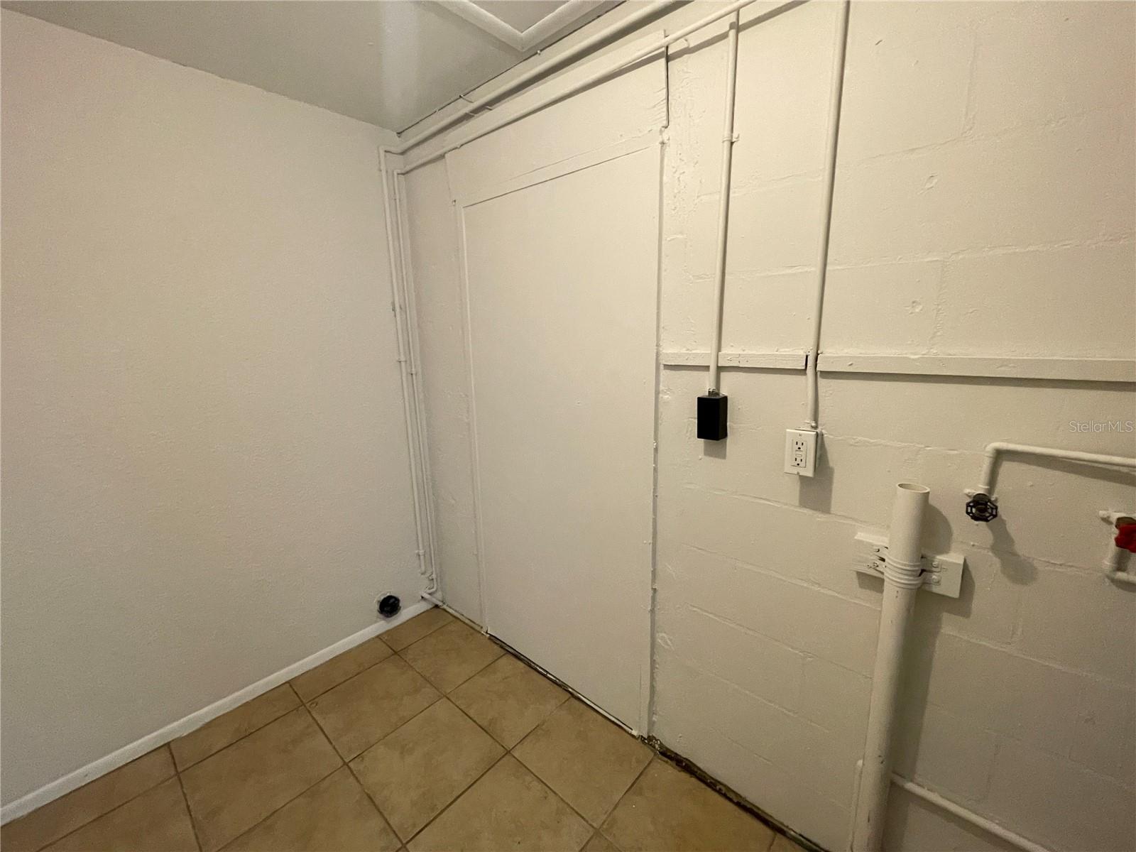 Utility Room adjacent to the kitchen.