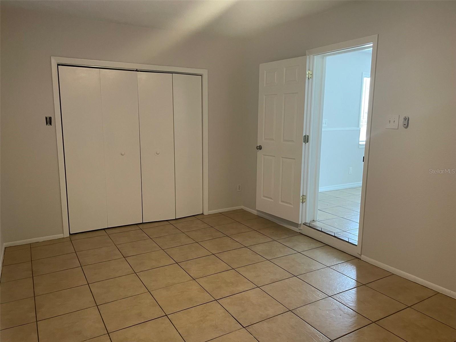 Bedroom 4:open door on right leads to living area.