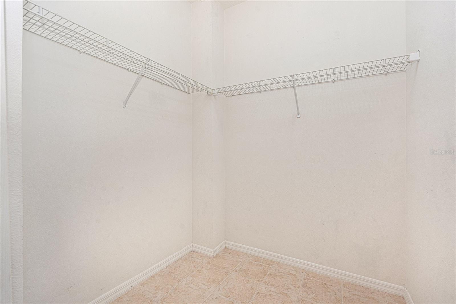 Walk-in closet in the Primary Bedroom