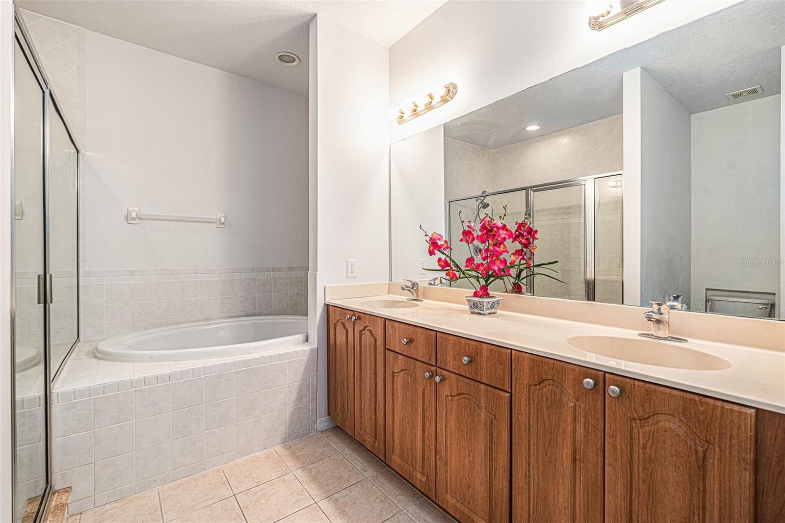 Master bathroom with a Garden tub, walk-in shower as well as His & Hers sinks