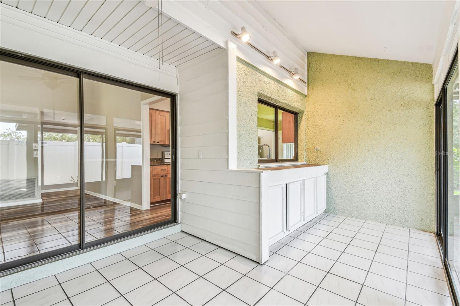 Large Sunroom with sliders leading out to patio