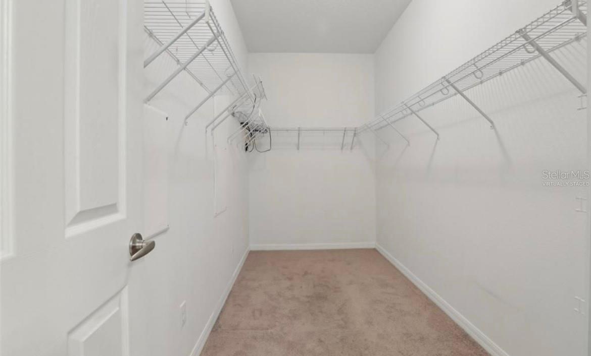 Huge walk in closet (Virtually Staged)