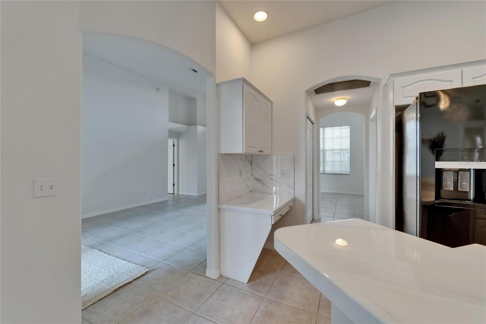 Kitchen looking into living area/foyer