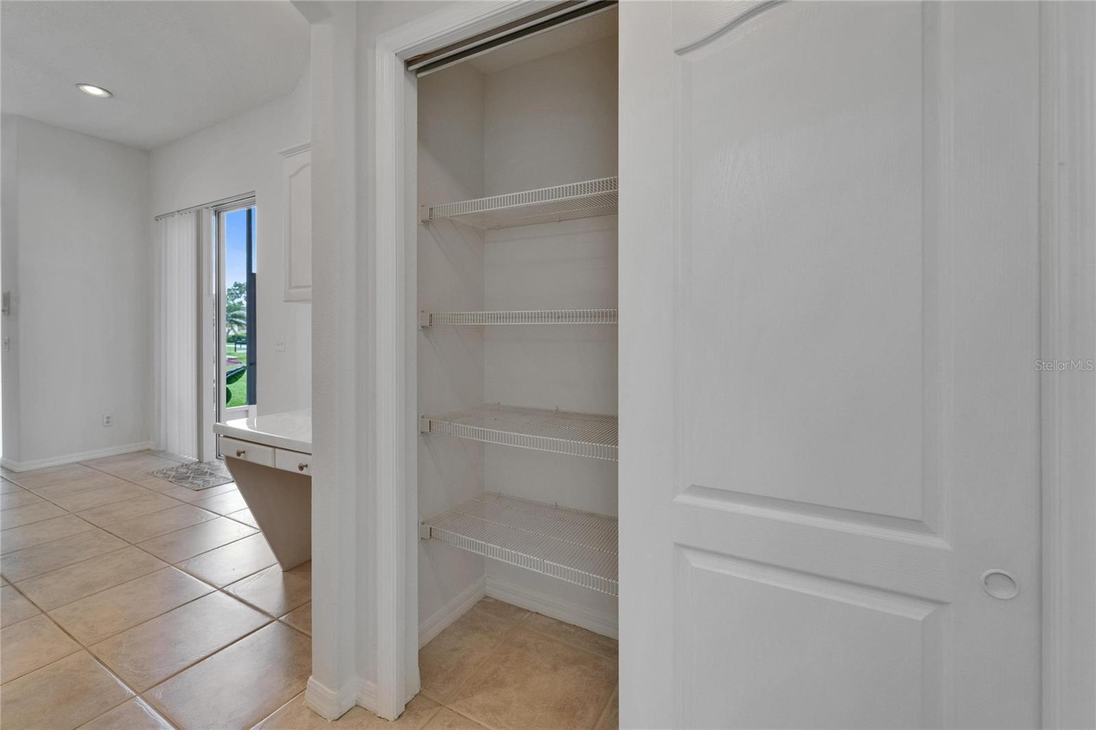 Pantry between kitchen and dining room
